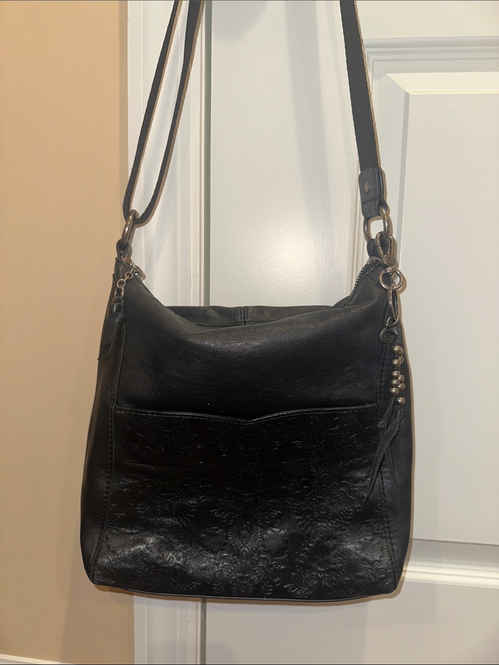 The Sak Leather Crossbody Laser Etch Engraved Embossed Floral Bag Black
